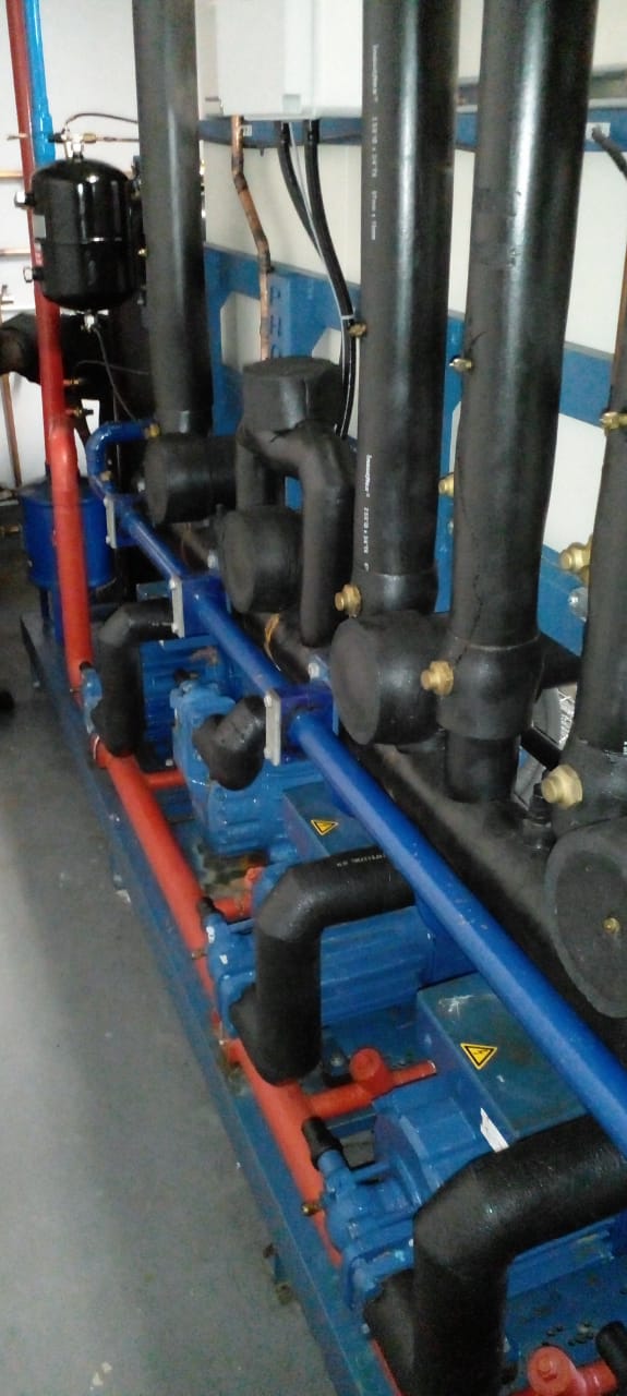 HVAC technician servicing AC unit